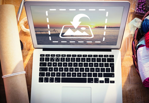 Laptop on Table with Wrapping Supplies Mockup 3