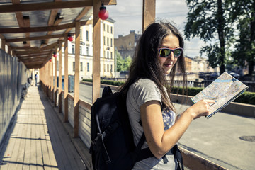 Young woman exploring the city map