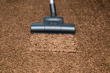 Professional vacuum cleaner turbo brush frees the carpet from dust. Early spring cleaning or...
