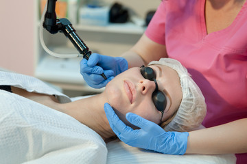 cosmetic procedure on the face using a laser