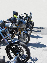Fototapeta na wymiar Motorcycles parked in row on asphalt