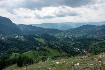 View to the carpathian mountains and romanian village from the t
