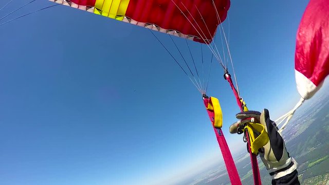 Skydiver is  opening parachute, view from helmet