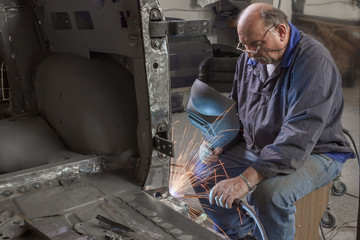 portrait of an elderly mechanic