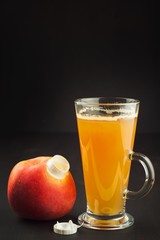 Healthy fresh apple juice drink on wooden background. Domestic production of apple juice for breakfast.
