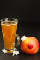 Healthy fresh apple juice drink on wooden background. Domestic production of apple juice for breakfast.
