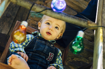 baby barefoot with colored lights