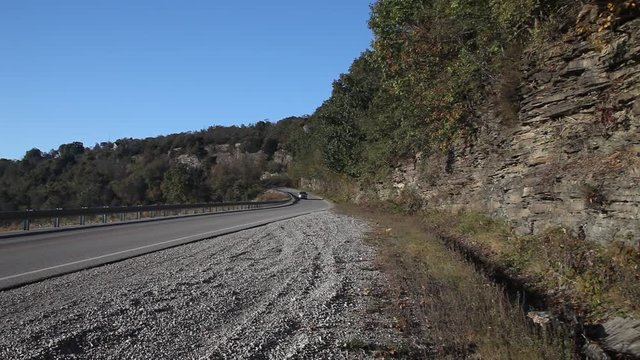 Highway in the Ouachita national forest with a truck driving.