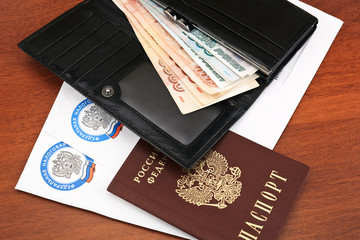 Russian tax documents, passport and open wallet