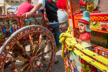 Closeup view of a colorful detail of a typical sicilian cart