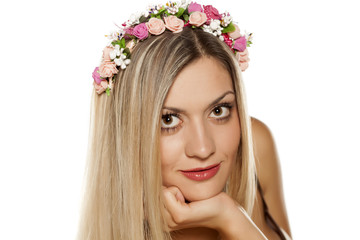 pretty girl with a wreath of flowers in her hair