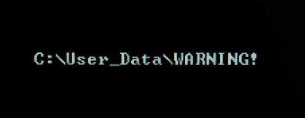 Computer screen shot of black background and white warning security text