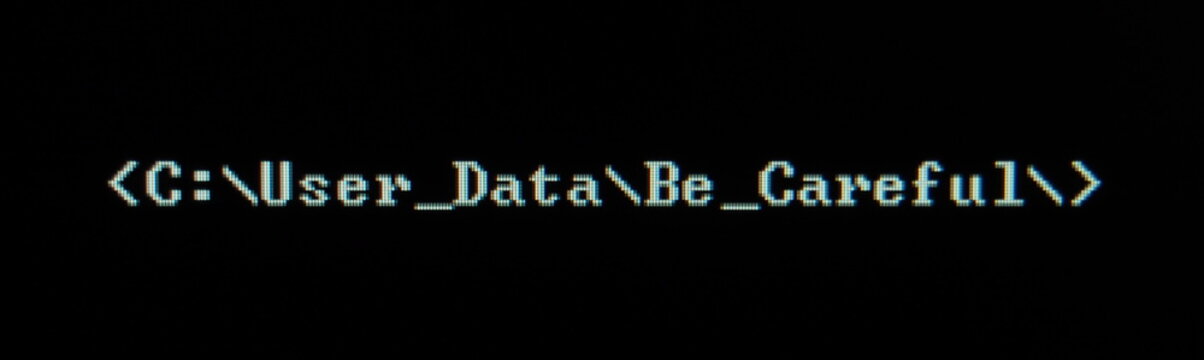 Computer screen shot of black background and white warning security text