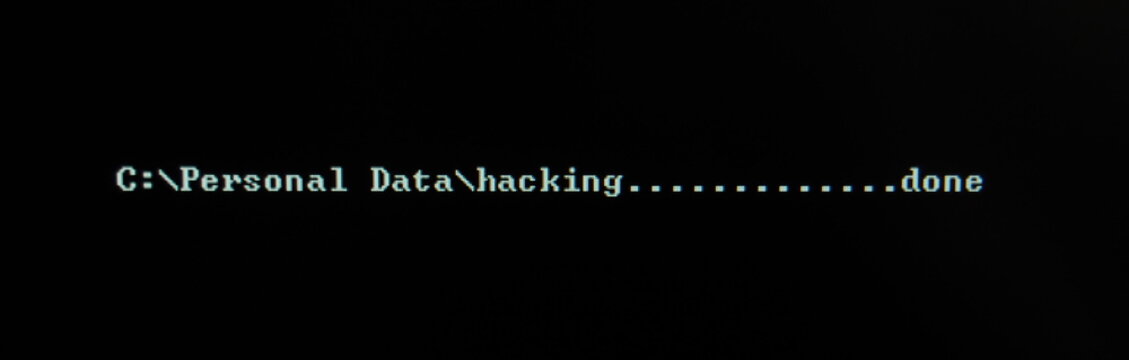 Computer screen shot of black background and white warning security text