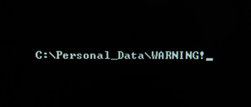 Computer screen shot of black background and white warning security text