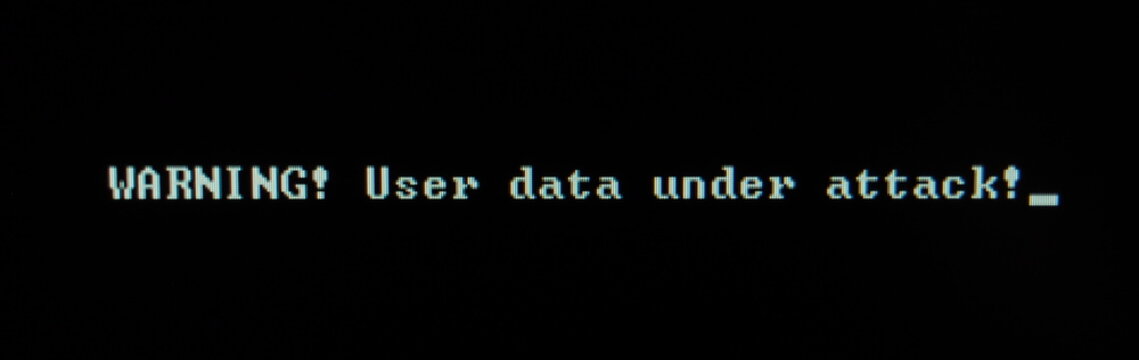 Computer screen shot of black background and white warning security text