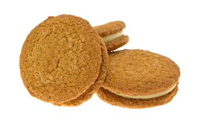 Cheesecake filled pumpkin cookies on a white background.