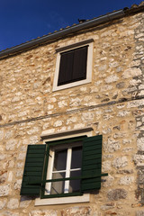 Window on authentic dalmatian building in Stari grad, Hvar island - Croatia