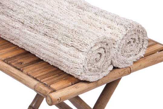 Cotton linen cut pile rug on natural bamboo table