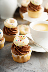 Cupcakes with chocolate frosting and little donuts
