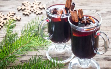 Two glasses of mulled wine with fir branch