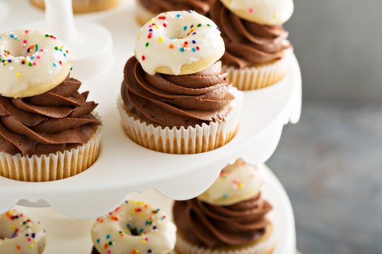 Cupcakes with chocolate frosting and little donuts