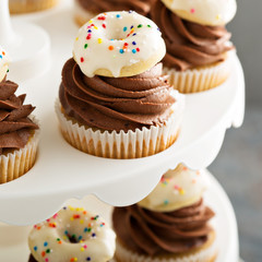 Cupcakes with chocolate frosting and little donuts