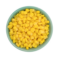 Organic sweet corn in a bowl on a white background top view.