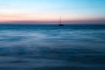Fototapeta premium A lone ship in an ocean.