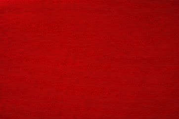 Red fabric background texture closeup.