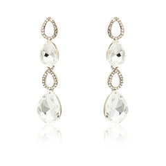 Pair of silver diamond earrings isolated on white