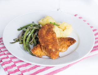 dish breaded cutlet, potatoes and green beans