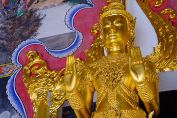 Beautiful of golden Buddha statue and thai art architecture in Wat Bovoranives, Bangkok, Thailand. Photo taken on: October 30, 2016