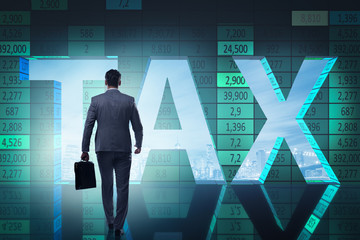 Businessman in high taxes concept