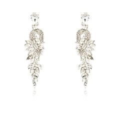 Pair of silver diamond earrings isolated on white