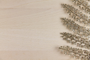 golden fern on wooden background
