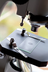 close up macro microscope with blood sample in the laboratory