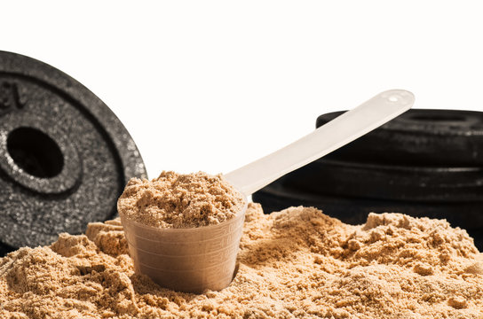 Scoop Of Whey Protein On White Background. Chocolate Flawour