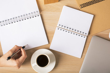 Female writing in notepad