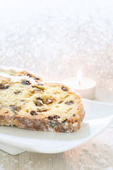 Fresh Christmas Stollen on a white plate.
