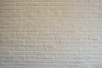 white wall under yellow lamp in cafe