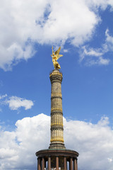 Bottom view of Victory Column with cloudy blue sky background at Tiergarten in Berlin