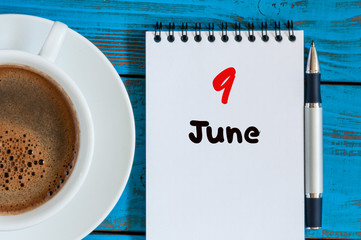June 9th. Image of june 9 , calendar on blue background with morning coffee cup. Summer day, Top view