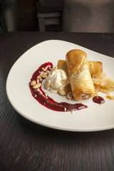 ice cream topped with raspberries..