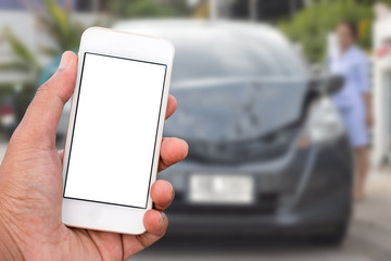 Hand holding mobile smart phone with blank screen in vertical position, blurred background - mockup template