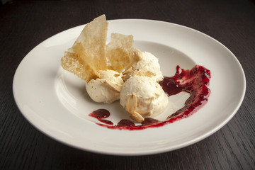 ice cream topped with raspberries..