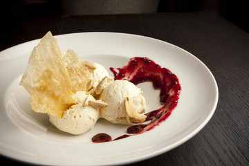 ice cream topped with raspberries..