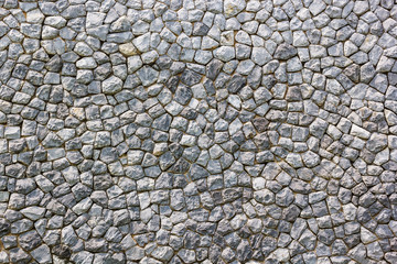 Texture and background of granite stone wall.