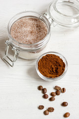 Homemade body peeling cocoa-sugar on wooden background close up