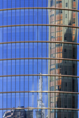 Reflection of a building in the windows of another office buildi